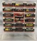 Collection of 16 Dale Earnhardt die cast cars and display