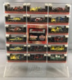 Collection of 16 Dale Earnhardt die cast cars and display