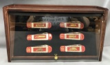 Franklin Mint historical fire engine knife collection in display case