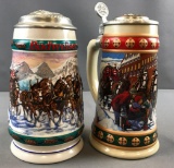 Group of 2 Budweiser Holiday artist signed steins