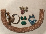 Group of 8 pieces women?s jewelry, watches, pins, collar and clip on earrings