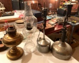 Group of four antique oil lamps