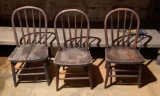 Group of three primitive wood chairs