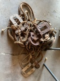 Group of vintage metal pulleys and rope