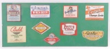 Group of Vintage Soda and Beer Advertising Bottle Labels in Glass Display
