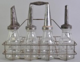 Group of 5 Jay B Rhodes Glass Motor Oil Bottles with Finger Groove, Spouts, and Rhodes Carrier