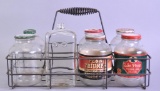 Group of 7 Vintage Glass Motor Oil 1 Qt. War Jars with Carrier