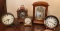 Group of 5 clocks including Bulova and others