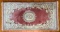 Antique rose colored oriental rug with floral design