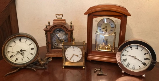 Group of 5 clocks including Bulova and others