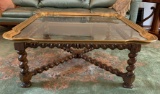 Antique coffee table with turned legs and glass