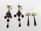 Pair of Gold and Black Earrings
