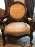 Antique Victorian curved back upholstered arm chair