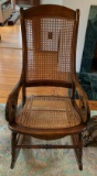 Antique caned rocking chair