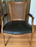 Vintage caned chair with leather seat