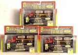 Group of three matchbox premiere collection diecast semi trucks in original packaging