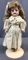 Antique Bisque Porcelain doll on stand