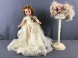 Vintage doll and doll hat stand with hat