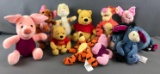 Group of Winnie the Pooh plush characters