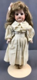 Antique Bisque Porcelain doll on stand