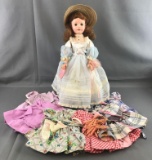 Vintage 1956 American Character Doll with 6 outfits and hair curlers.