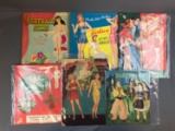 Group of six vintage paper doll sets