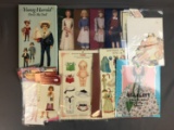 Group of paper doll sets including Shirley Temple, American girl, and more