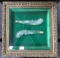 2 frosted pistol shaped bottles in wood and glass Showcase frame