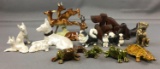 Group of vintage animal figurines made of wood, porcelain, and more