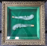 2 frosted pistol shaped bottles in wood and glass Showcase frame