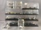 Group of 28 toy replica airplanes in plastic display boxes