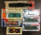 Group of 7 HO scale model train cars in original packaging