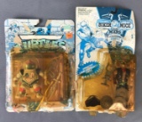 Group of 2 vintage action figures with original packaging