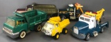 Group of 5 die-cast metal and plastic tow trucks and dump trucks