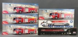 Group of 6 toy trucks in original packaging