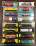 Group of 16 N scale model train cars in original packaging
