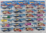 Group of 22 Hot Wheels Haulers Die-Cast Semi Trucks in Original Packaging