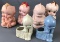 Group of 6 ceramic and porcelain Kewpie style planters and more