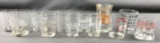 Group of 12 antique advertising shot glasses