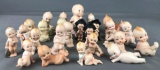 Group of 25 porcelain Kewpie figurines