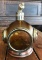 Amber glass, copper, and brass diving helmet decanter