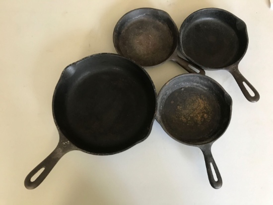 Group of 4 vintage cast iron pans