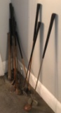 Group of vintage golf clubs and more