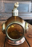 Amber glass, copper, and brass diving helmet decanter