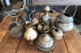 Group of 12 copper watering cans, pitchers, and more