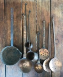 Group of 8 copper ladles, slotted spoons and more