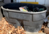 Large Rubbermaid tub with miscellaneous lawn items
