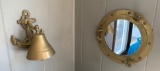 Brass bell and porthole mirror