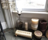 Group of candles, candle holders and plant stand