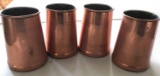 Four copper mugs